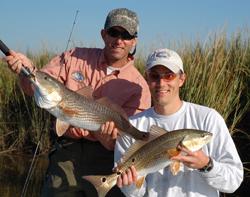 tim and partner jeff with 2 nice redfish